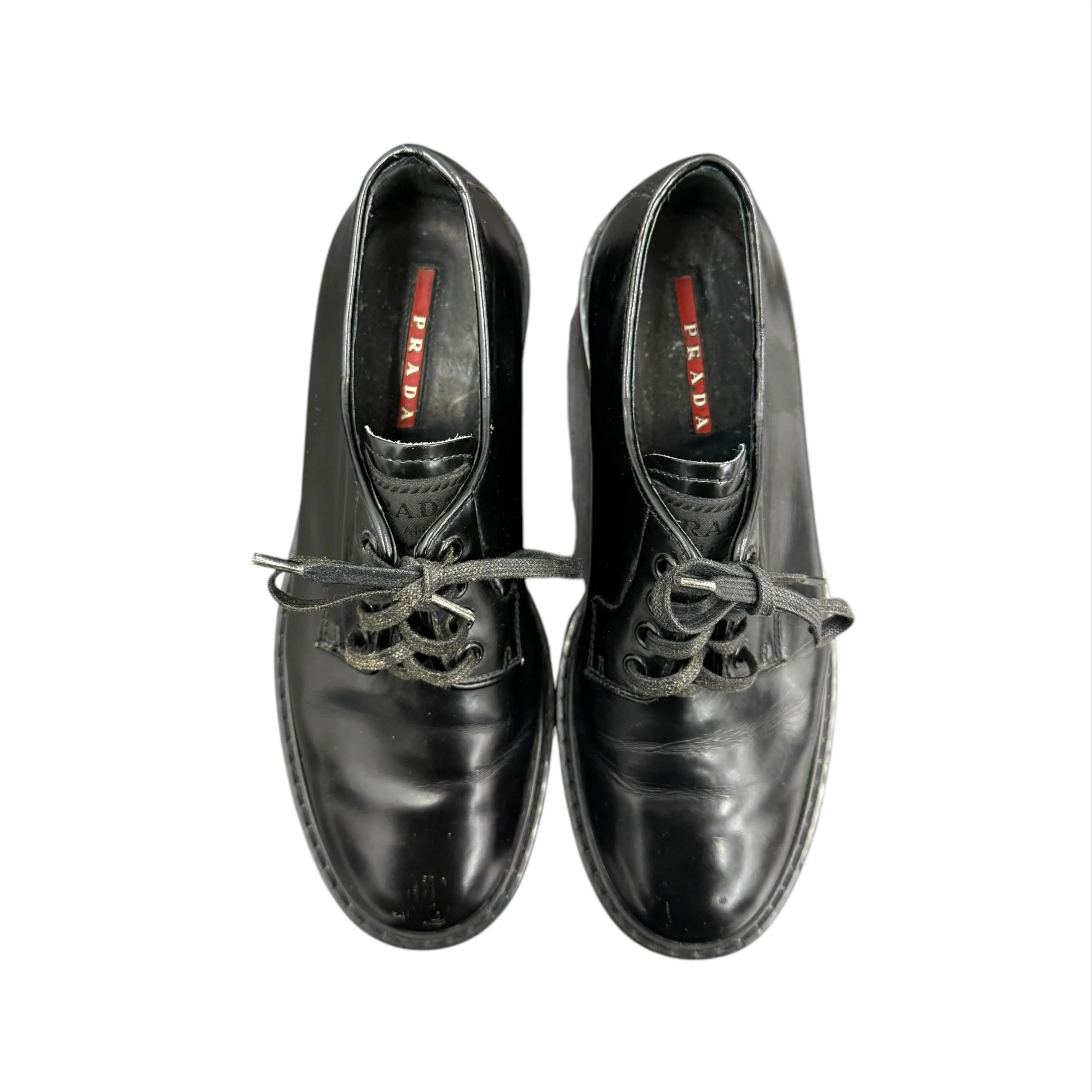 Prada black lace-up loafers